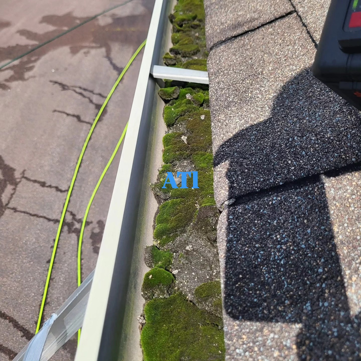 Gutters clogged with debris, leaves, and dirt buildup before cleaning